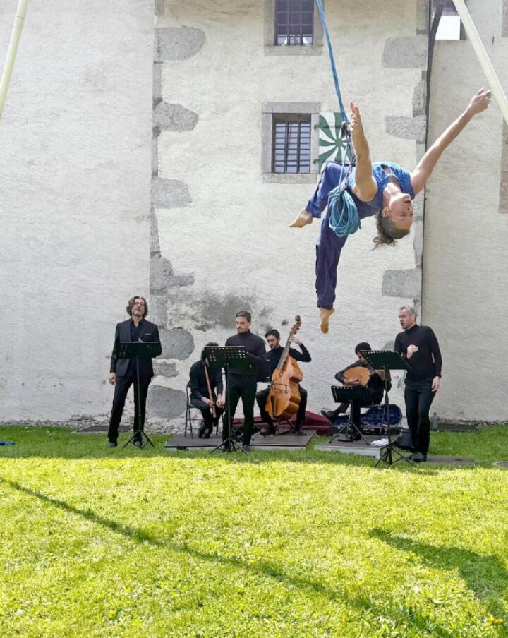 Sverine Bennevault Caton "dances" through the air high above the performers, musicians, and audience. | PHOTOS: TINA DOSOT