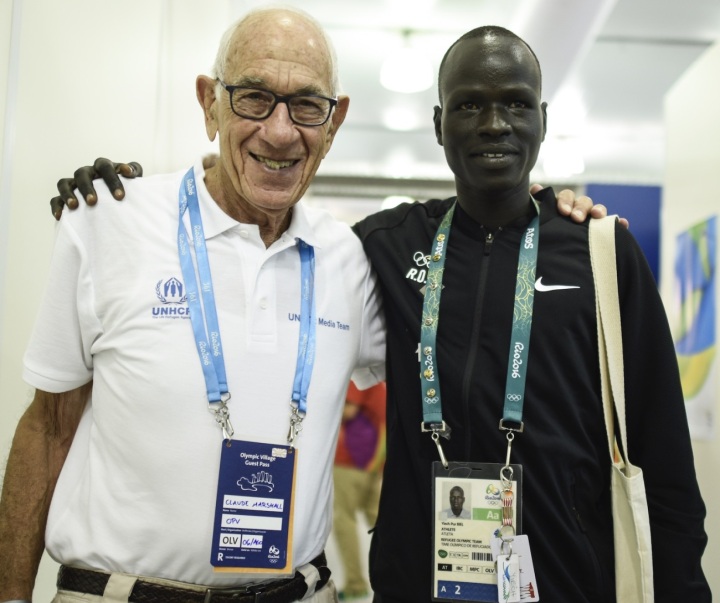 Claude and Yiech Pur Biel, UNHCR refugee athlete, on the running team, at the Rio Olympics 2016 | Photo courtesy of UNHCR